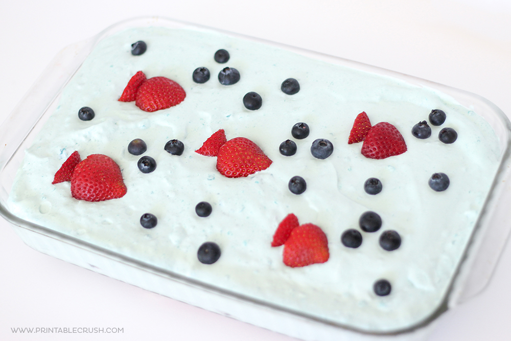 Serve this Ocean Berry Icebox Cake at your next ocean or beach themed party! It's really easy to make and anyone can decorate it!