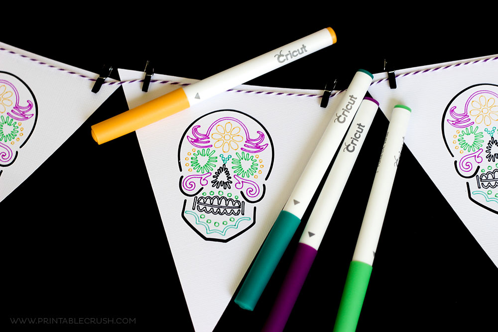 Use different Cricut Pen Colors to create this gorgeous Dia De Los Muertos banner!