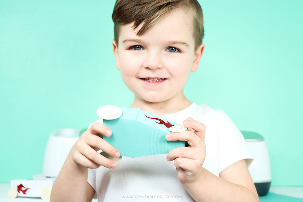 Your child will love helping you make these Paper Toy Cars with the Cricut Scoring Wheel!